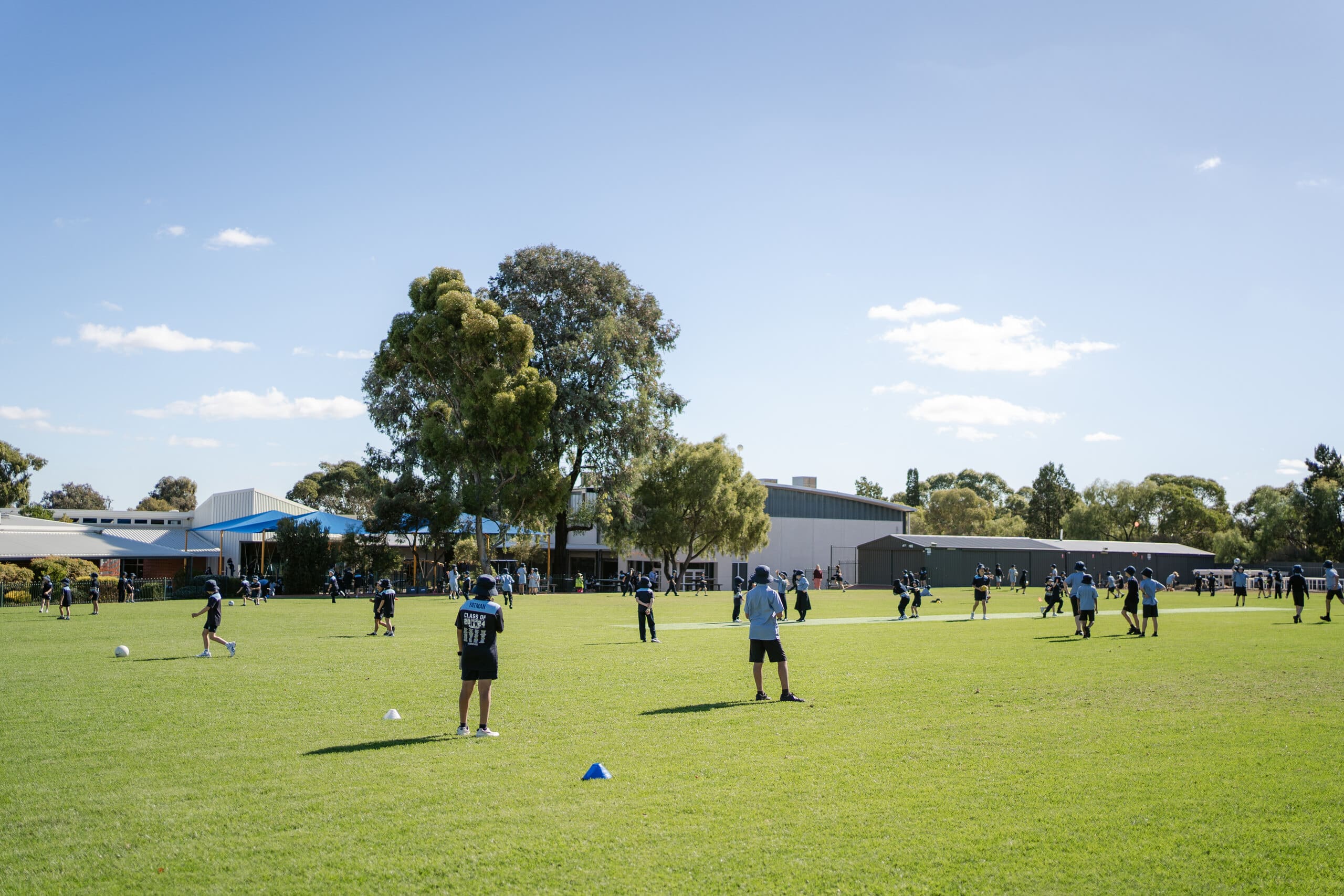 Students playing on a school oval