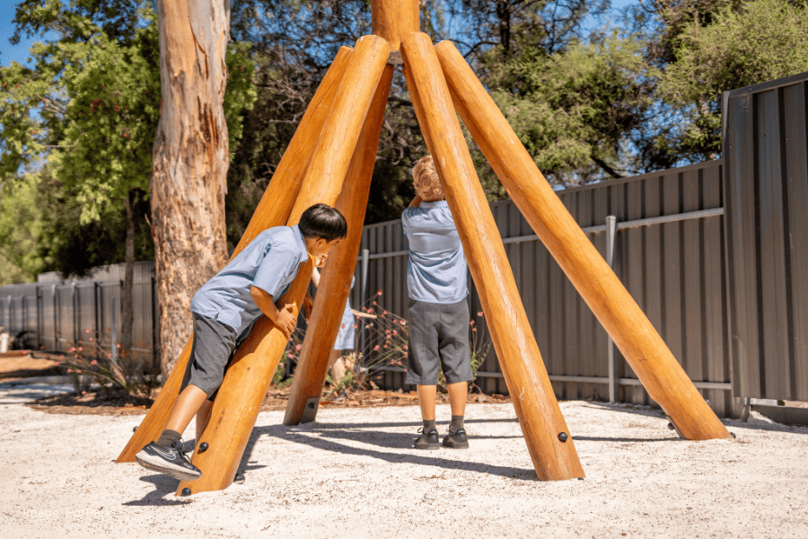 Students of Good Shepherd Lutheran School are playing on the nature play equipment. Image taken by ForPark.