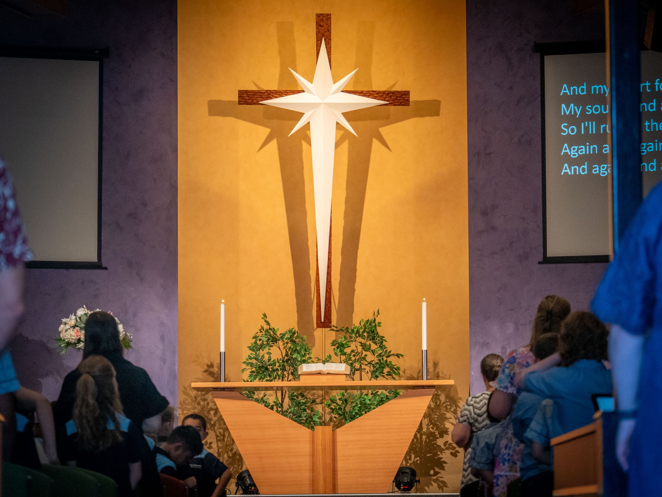Photo of the stage and cross at Good Shepherd Lutheran Church.
